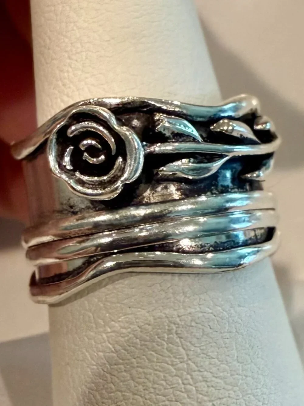 Sterling silver spinner ring an oxidized floral rose design.